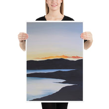 Load image into Gallery viewer, A mesmerizing art print of a golden sunset over a lake, with soft reflections rippling on the water&#39;s surface.
